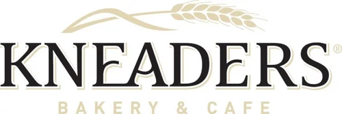 Kneaders Bakery & Cafe logo with wheat.